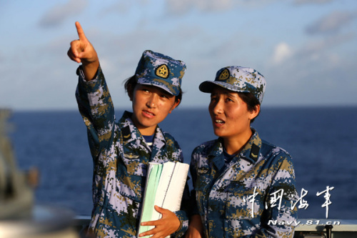 Yangkyi Tsering and Kunsang Drolma compare books to study naval information.