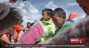 Firefighters visit children at camp in Shigatse