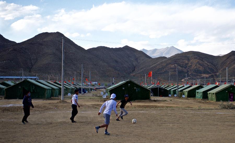 Youngsters play football at relocation sites in Shigatse, Tibet