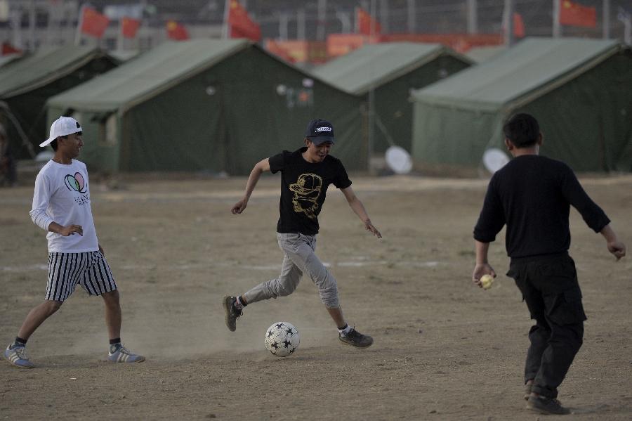 Youngsters play football at relocation sites in Shigatse, Tibet