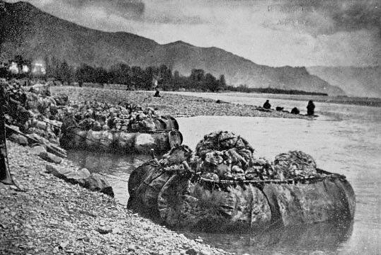 Yak skin coracles loaded with wool.