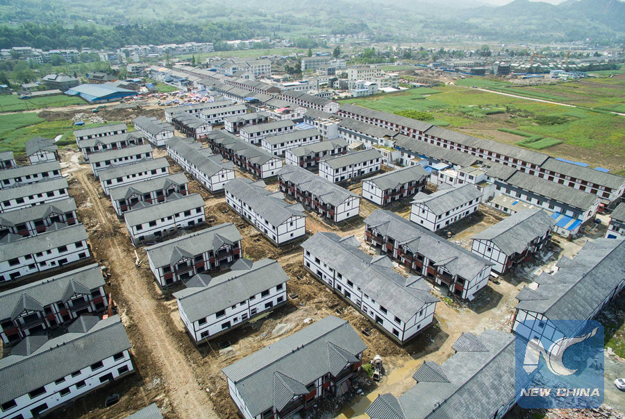 An aerial view of Fujiaying New Village of Qinglongchang Village of Longmen Township in Lushan County, southwest China's Sichuan Province, is seen in this picture taken on April 12, 2015, ahead of the two anniversary of the 7.0-magnitude earthquake hitting Lushan County on April 20, 2013. (Xinhua/Li Qiaoqiao)