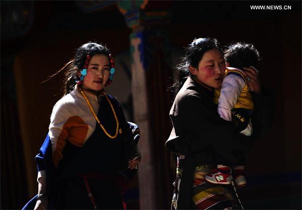 Believers pray for blessings at Drepung Monastery in Lhasa