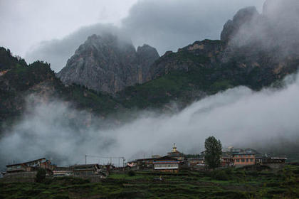 Fog shrouds mountains in Zhagana