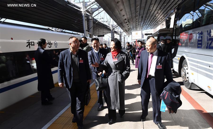 Members of 12th CPPCC National Committee arrive in Beijing 